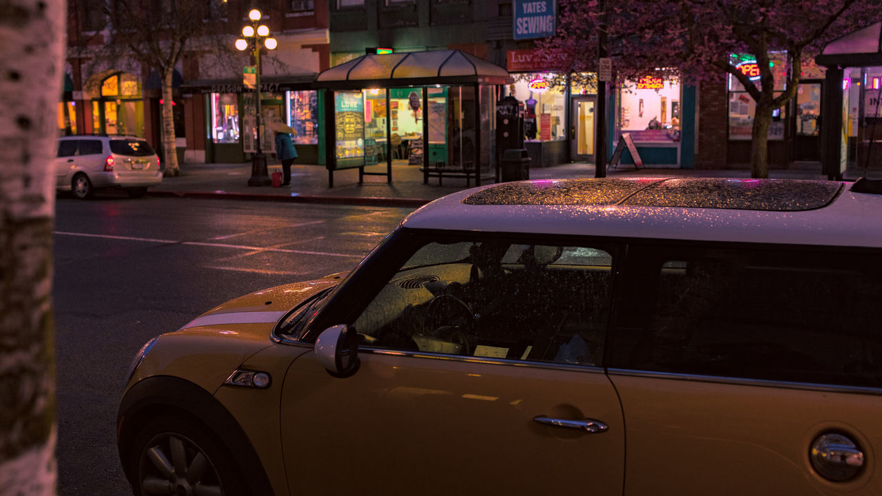 VIEW OF CITY STREET AT NIGHT