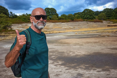 Hiker visits the caldera, a small circular crater with a marsh of sulphurous waters