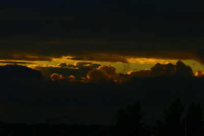 Scenic view of silhouette mountains against sky at sunset