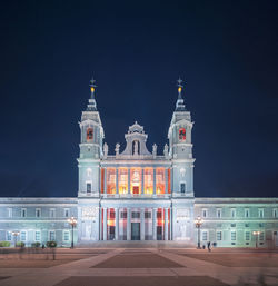 Facade of historic building against sky at night