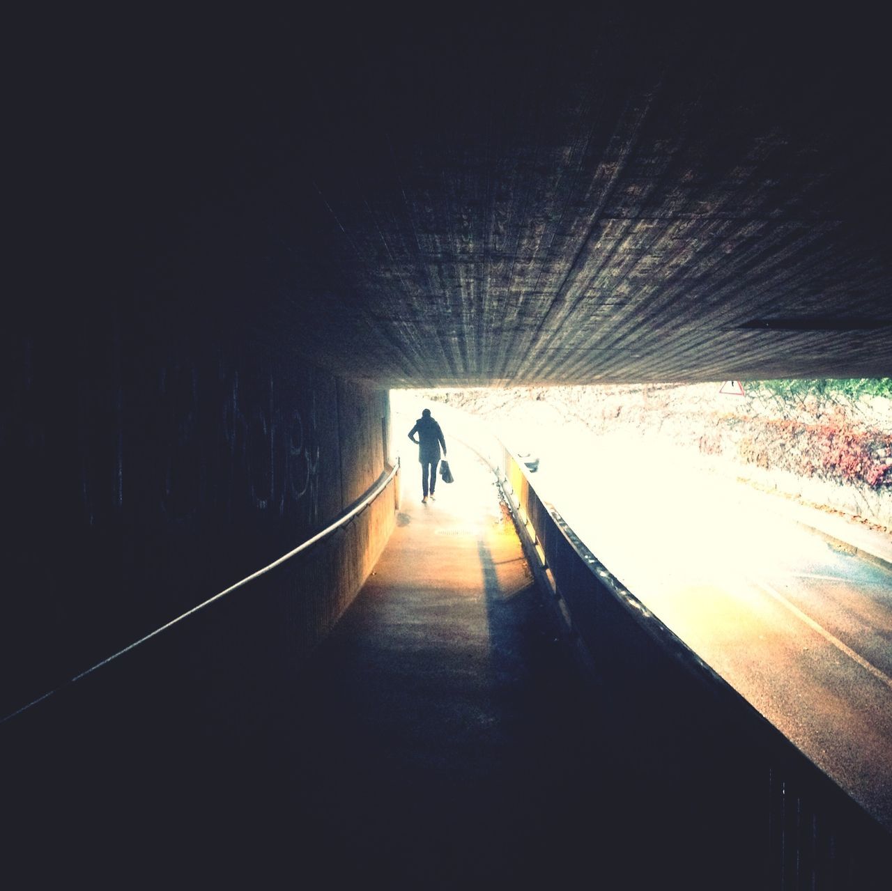the way forward, full length, walking, lifestyles, silhouette, rear view, men, tunnel, indoors, diminishing perspective, leisure activity, transportation, vanishing point, sunlight, unrecognizable person, person, on the move