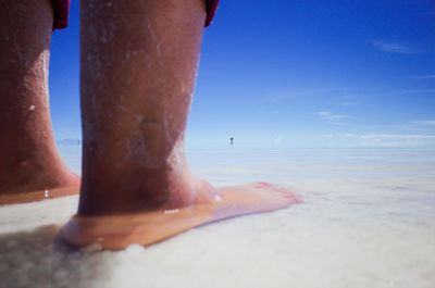 Low section of person on beach