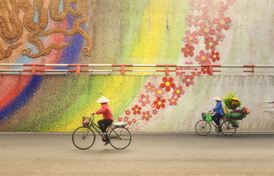 People riding bicycles