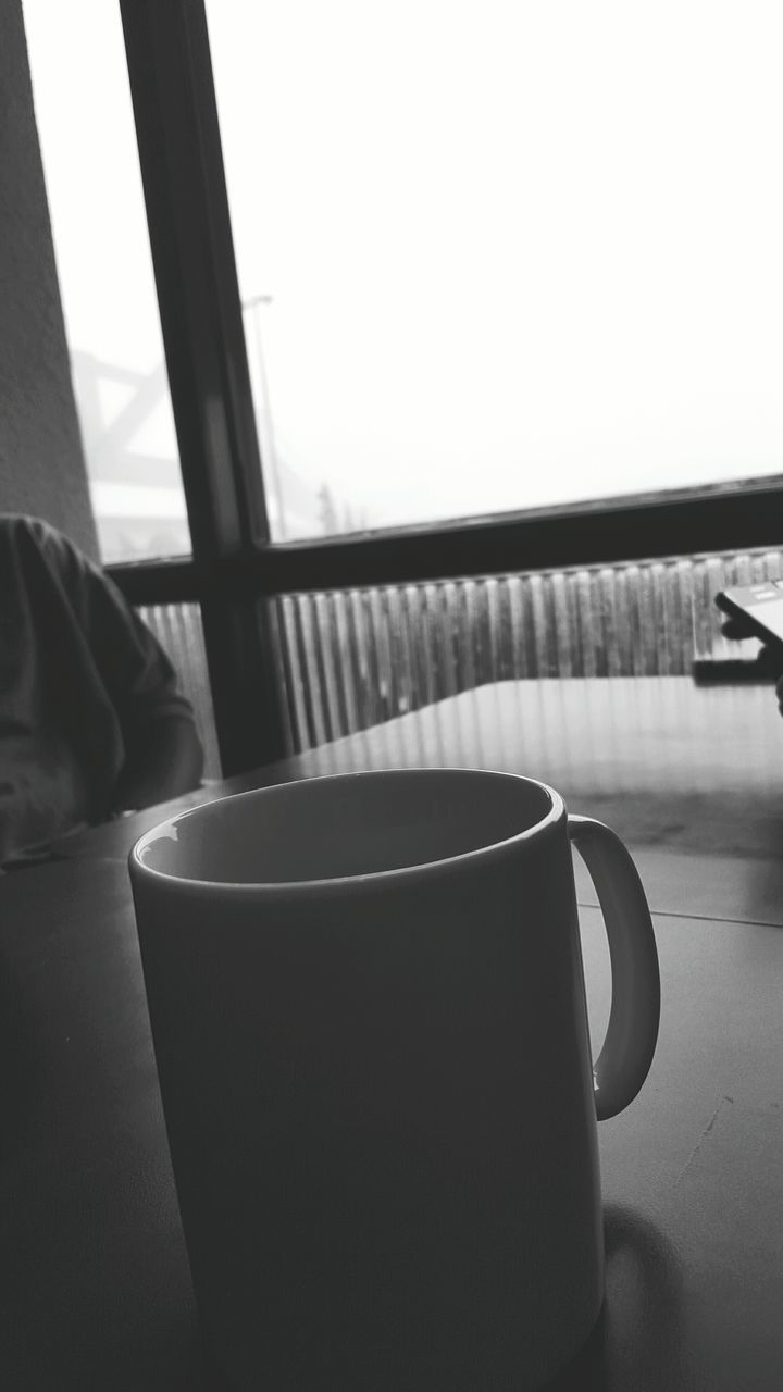 indoors, table, coffee cup, drink, food and drink, still life, chair, refreshment, coffee - drink, cup, close-up, coffee, empty, absence, saucer, home interior, window, focus on foreground, day, no people