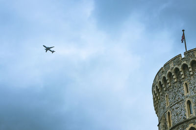 Low angle view of airplane flying in sky