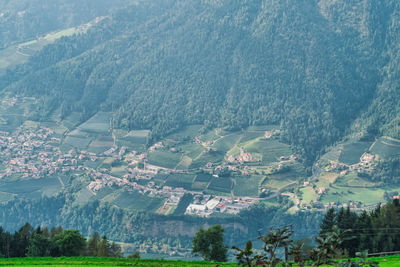 Aerial view of agricultural field by buildings