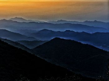 Scenic view of mountains against sky during sunset