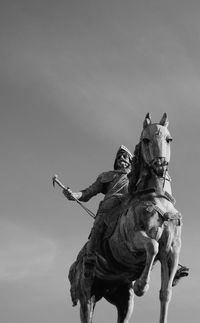 Low angle view of statue against sky