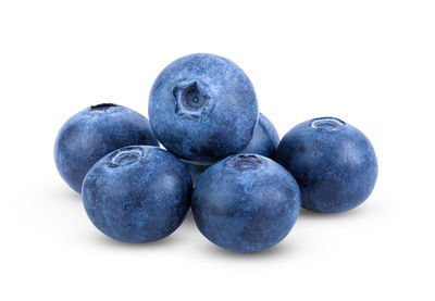 Close-up of blueberries against white background
