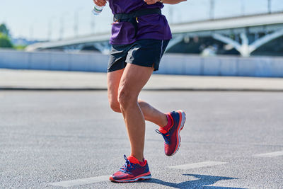 Full length of man running on bridge