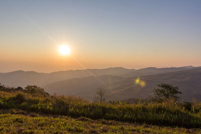 Scenic view of mountains against sky during sunset