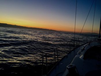 Scenic view of sea against clear sky during sunset