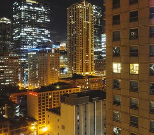 Aerial view of city lit up at night