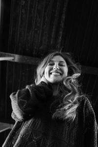 Portrait of smiling woman in snow