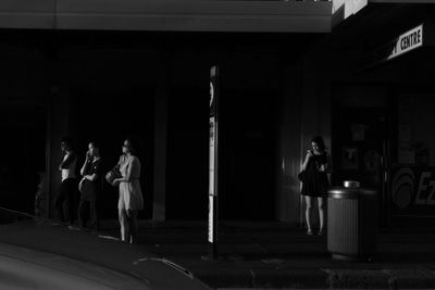 Close-up of woman in dark