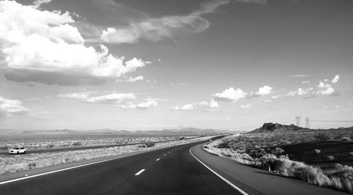 Empty road along landscape