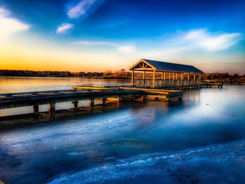 Scenic view of water against blue sky