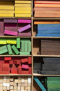 Full frame shot of colorful wooden blocks in container 