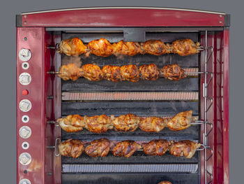 High angle view of meat on barbecue grill