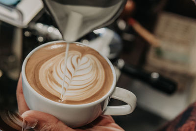 Close-up of cappuccino coffee cup