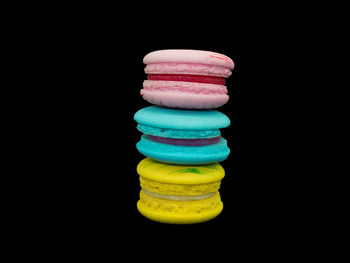 Close-up of colorful candies against black background