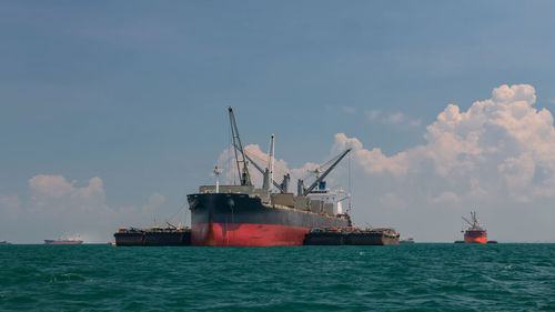 Ship in sea against sky