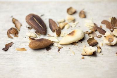 Close-up of crushed roasted almonds on table