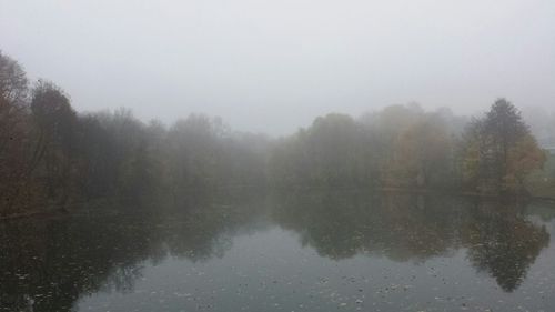 Scenic view of lake during foggy weather