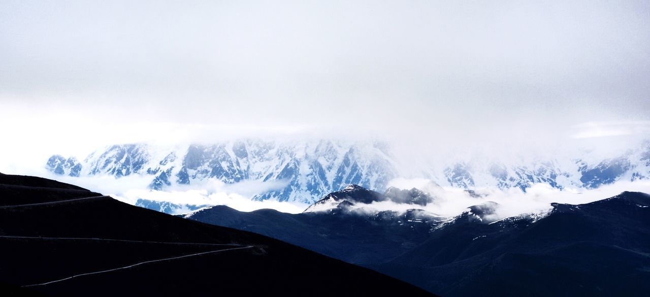 mountain, snow, winter, cold temperature, mountain range, scenics, weather, snowcapped mountain, beauty in nature, tranquil scene, season, tranquility, nature, landscape, fog, sky, non-urban scene, majestic, idyllic, covering