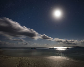 Scenic view of sea against sky at night