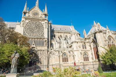 Notre dame de paris - famous cathedral with blue sky before fire april 15, 2019