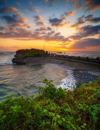 Scenic view of sea against sky during sunset