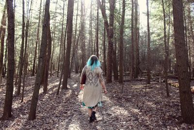 Rear view of woman in forest