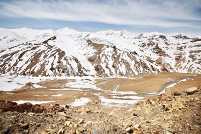 Scenic view of snowcapped mountains against sky