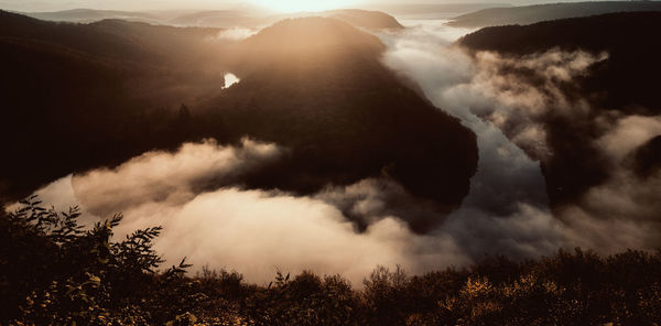 Scenic view of silhouette mountains against sky