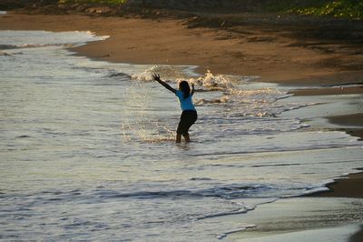 Woman standing at beach