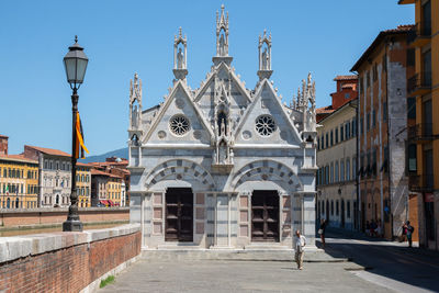 Tourists in front of buildings