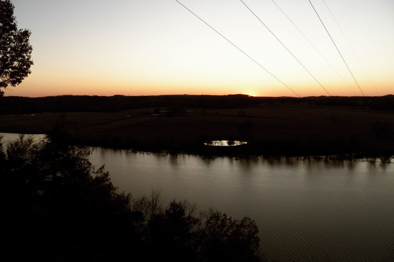 SCENIC VIEW OF SUNSET OVER LAKE