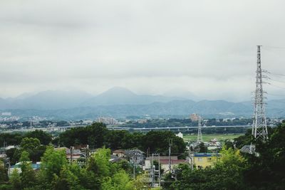High angle view of buildings and trees against sky