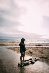 Full length of man on beach against sky