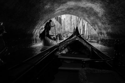 Silhouette man on boat in water