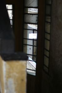 Close-up of building seen through window