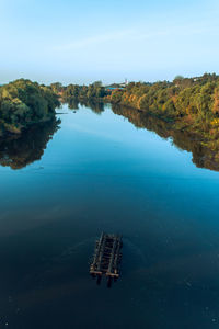 Aerial view to the klyazma river and wooden construction from auto and pedestrian bridge