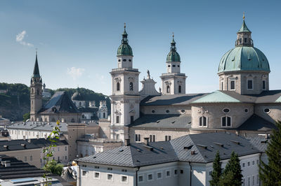 Buildings in city against sky