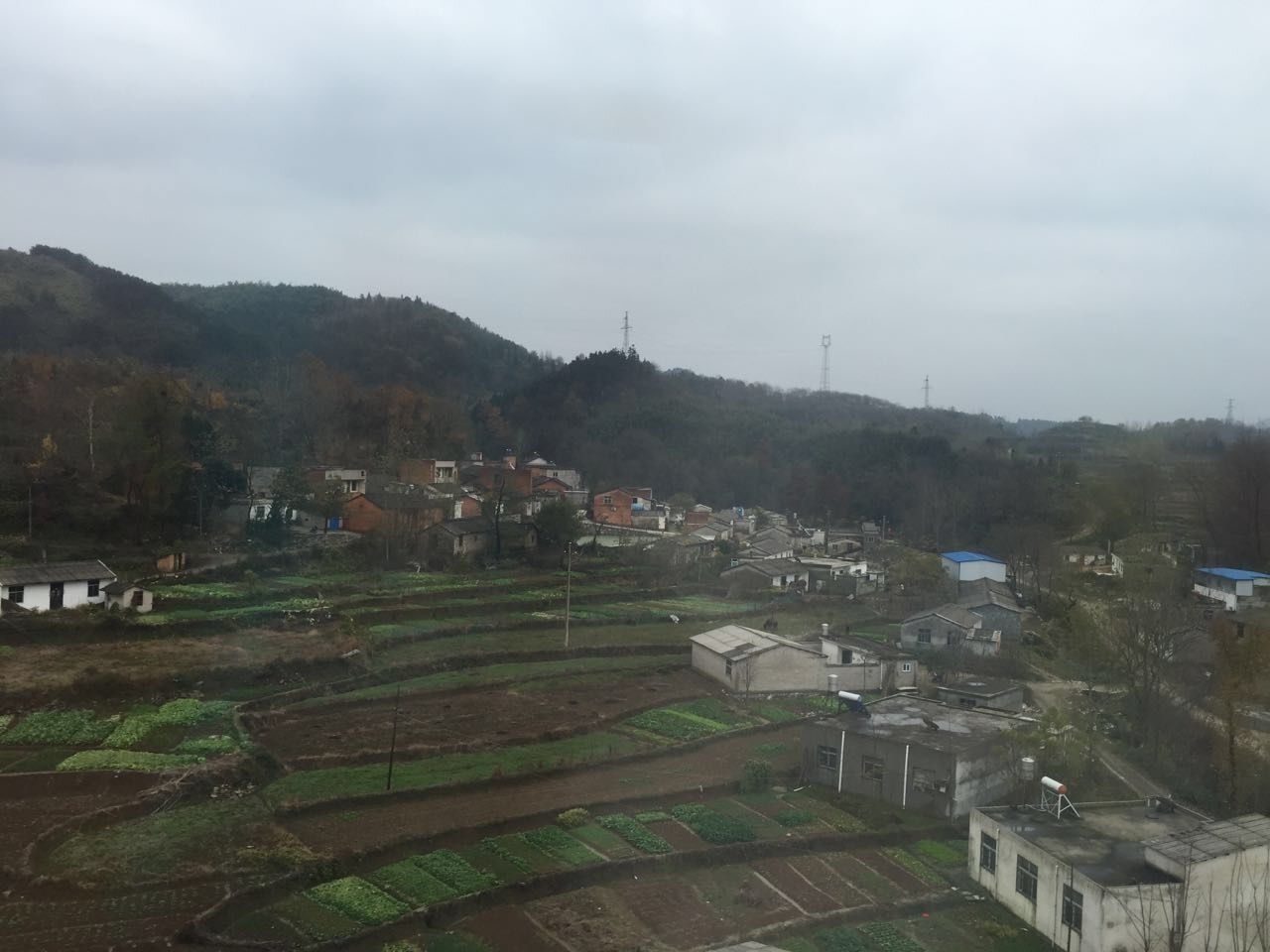 building exterior, built structure, architecture, sky, landscape, house, cloud - sky, rural scene, field, high angle view, mountain, residential structure, cloudy, tree, agriculture, village, day, nature, cloud, outdoors