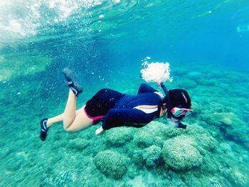 Woman snorkeling undersea