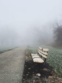 Scenic view of landscape against sky during foggy weather