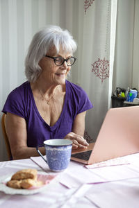 Senior woman using laptop