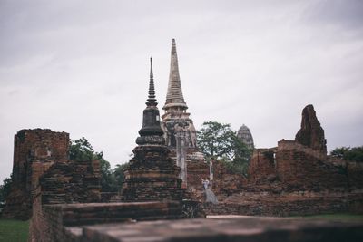 Low angle view of old temple building against sky