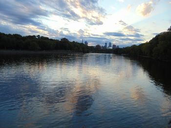 Scenic view of lake against sky at sunset